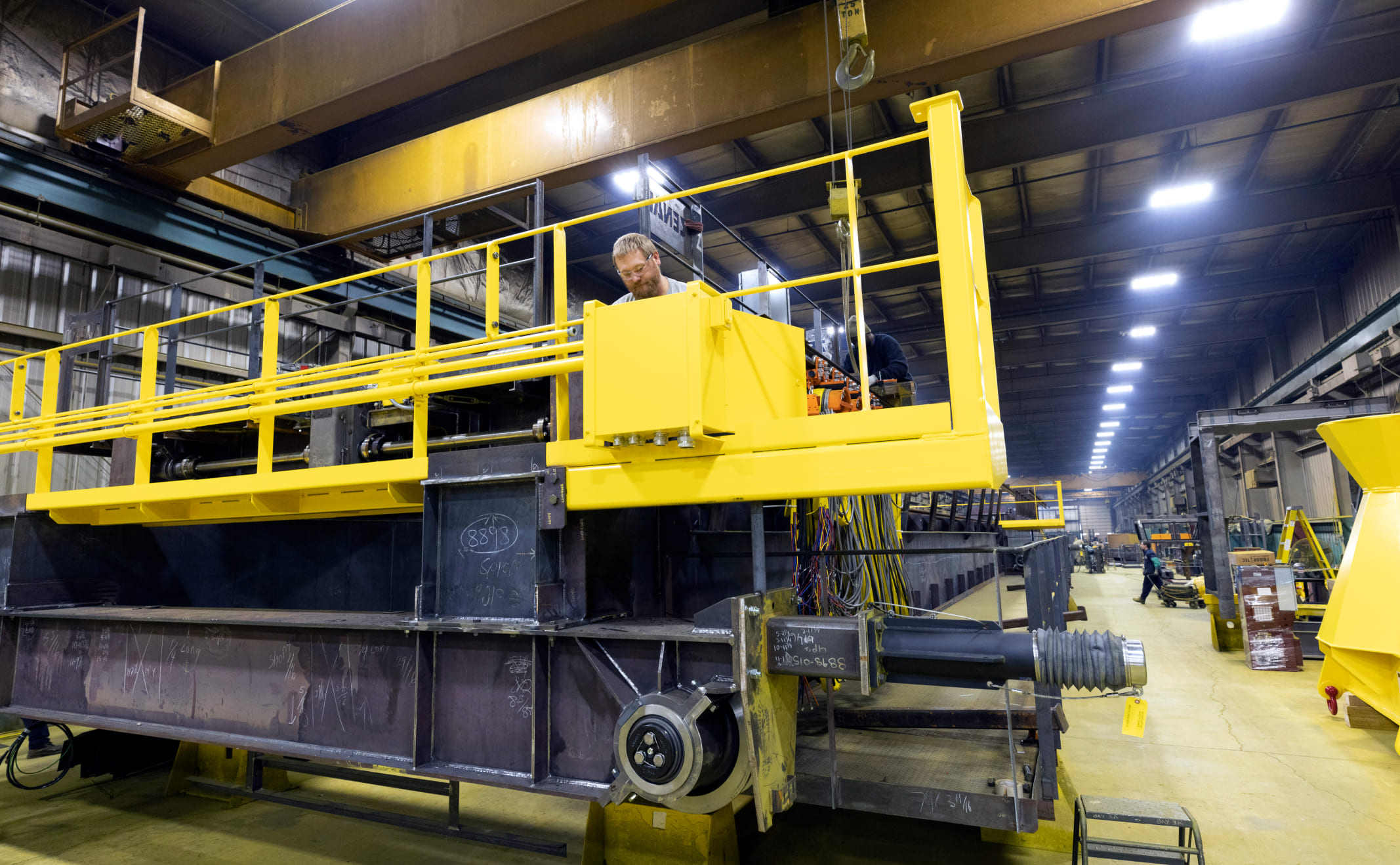 Zenar technician working on overhead crane transfer basket